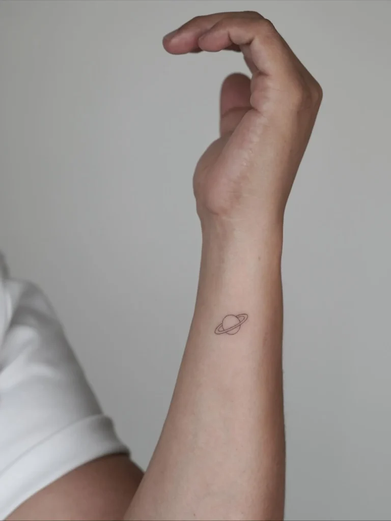 Micro Planet Hand Tattoo