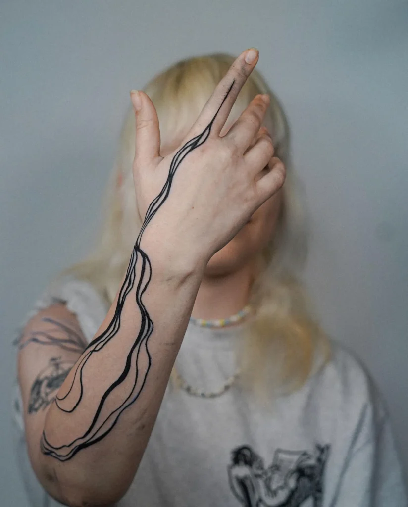 Single Line Back-of-Hand Tattoo