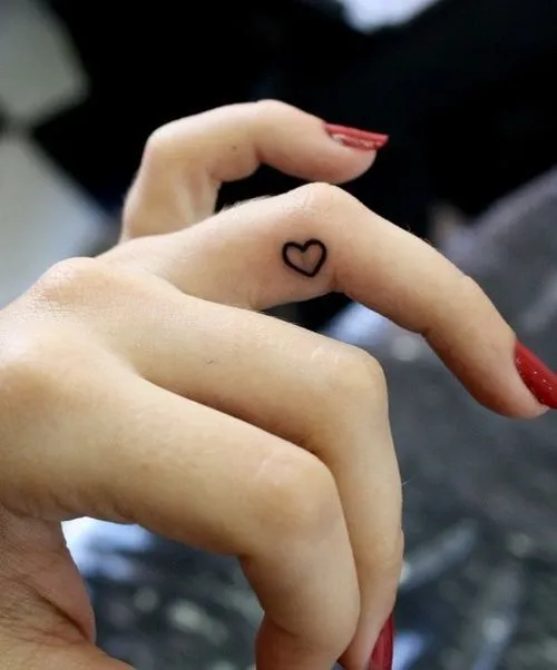 Tiny Heart Finger Tattoo