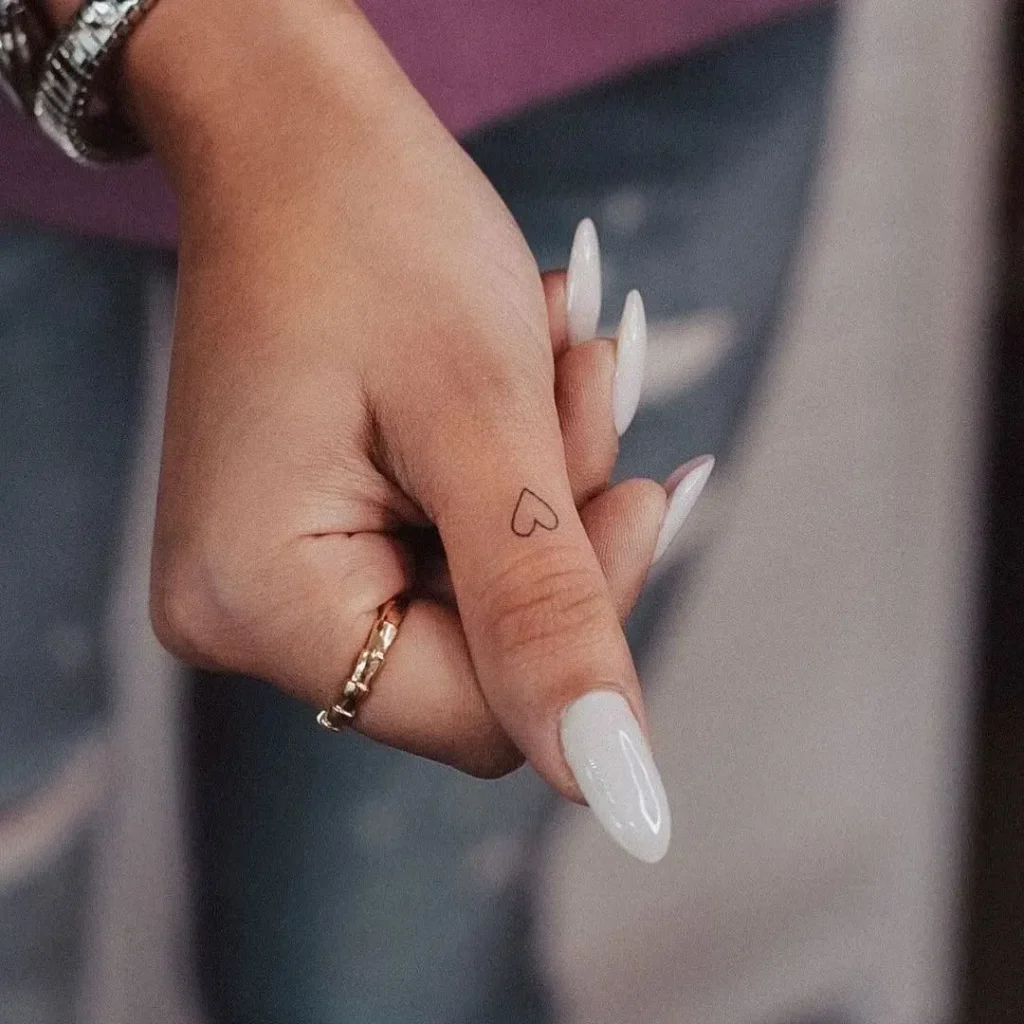 Tiny Heart Finger Tattoo