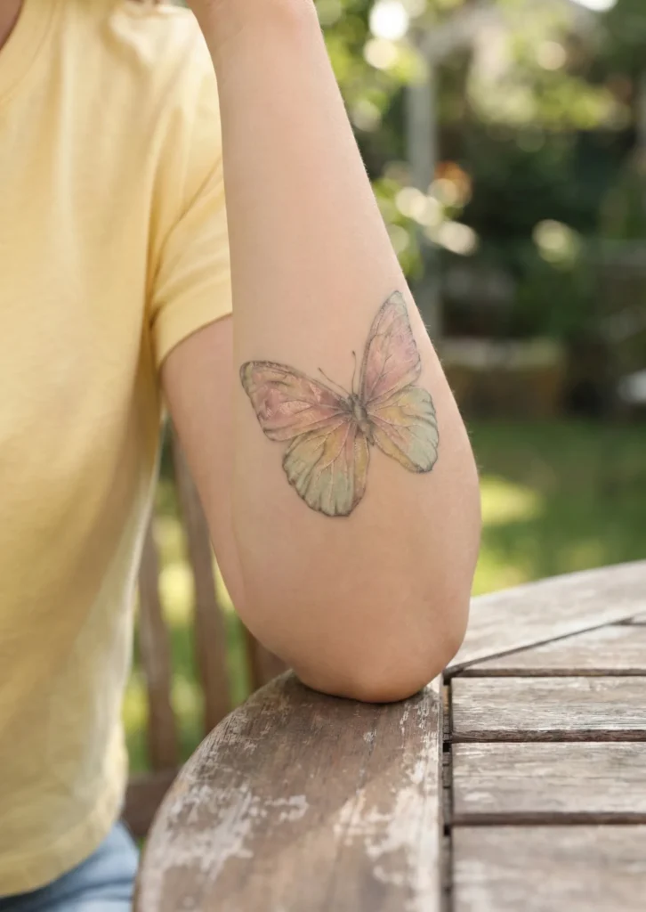 Vintage Butterfly Tattoo with Soft Pastel Shades