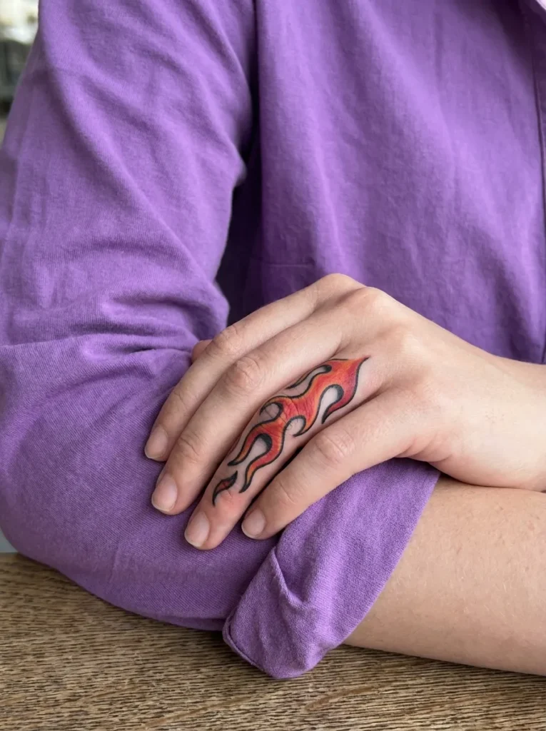 Flame Finger Tattoo