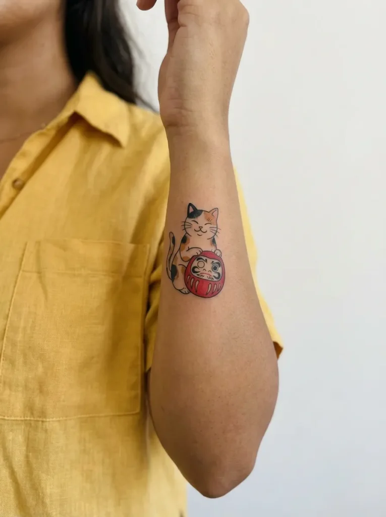 Cat with Daruma Doll