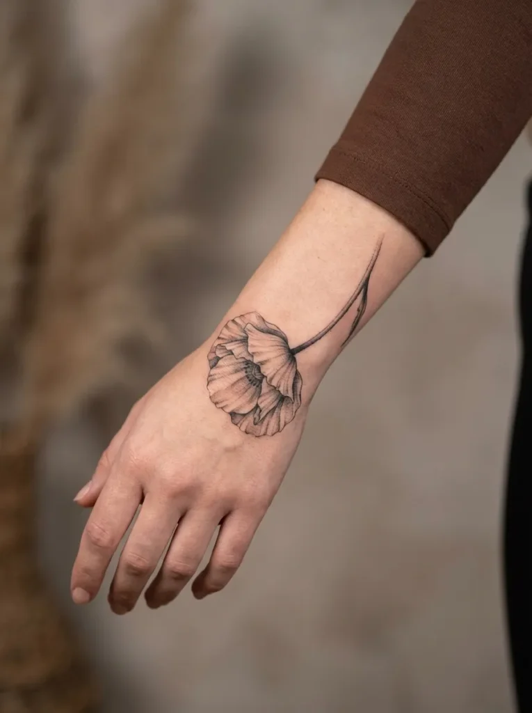 Poppy Flower Hand Tattoo